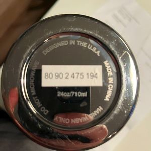 Large insulated BMW thermos.